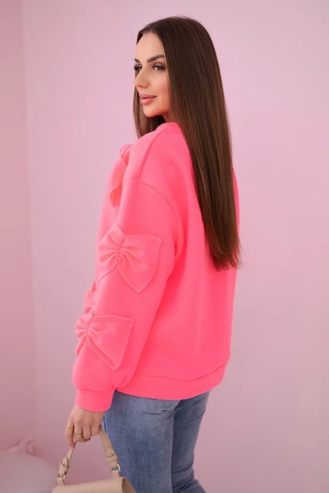 Bluza ocieplana z ozdobnymi kokardami różowy neon Bluza ocieplana z ozdobnymi kokardami różowy neon