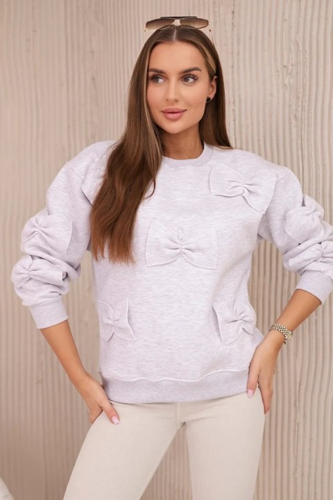 Bluza ocieplana ze ściągaczem i ozdobnymi kokardami beżowy melanż Bluza ocieplana ze ściągaczem i ozdobnymi kokardami beżowy melanż