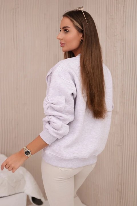 Bluza ocieplana ze ściągaczem i ozdobnymi kokardami beżowy melanż Bluza ocieplana ze ściągaczem i ozdobnymi kokardami beżowy melanż