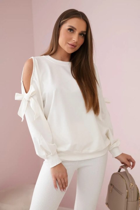Komplet bluzy z kokardą na rękawach i legginsów ecru Komplet bluzy z kokardą na rękawach i legginsów ecru