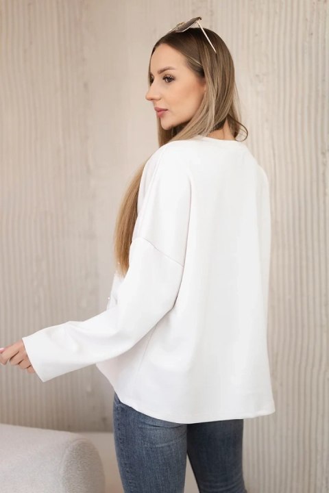 Bluza masełko z ozdobnym kwiatem beżowa Bluza masełko z ozdobnym kwiatem beżowa