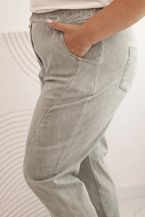 Spodnie damskie dekatyzowane Plus Size z gumką i kieszeniami beżowe