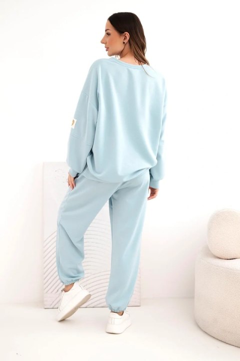 Komplet damski masełkowy z luźną bluzą i spodniami z napisem LOVE ciemno miętowy