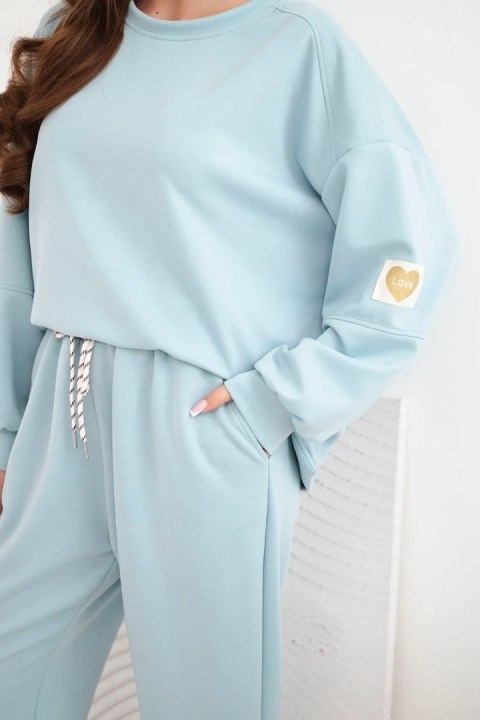 Komplet damski masełkowy z luźną bluzą i spodniami z napisem LOVE ciemno miętowy